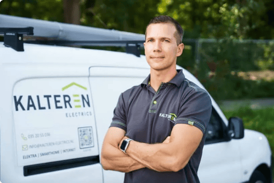 John Kalteren next to his company van